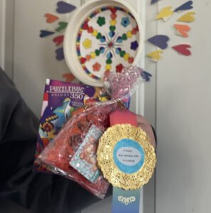 Presenting winning gift for Door Decorating contest
