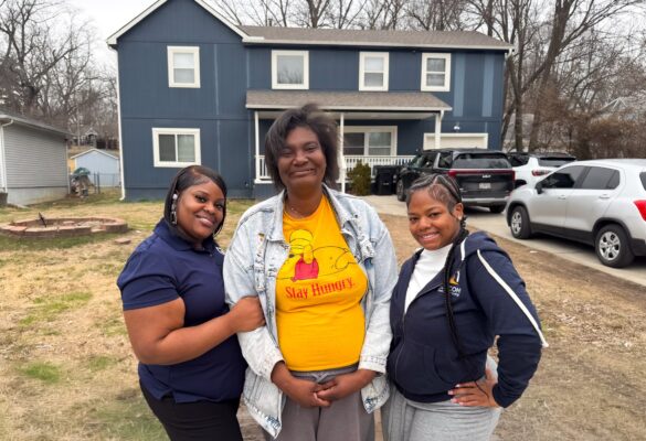Staff and Individuals MO 2.16.26-45 (1) Three women standing in front of a blue house.