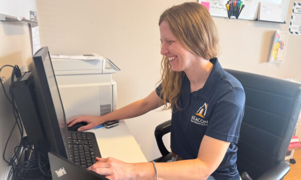 Staff and Individuals MO 2.16.26-11 Woman sitting at a desk working on a computer.