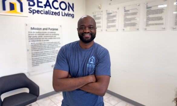 Staff and Individuals VA 1.12.26-120 Man standing in a Beacon branded lobby.