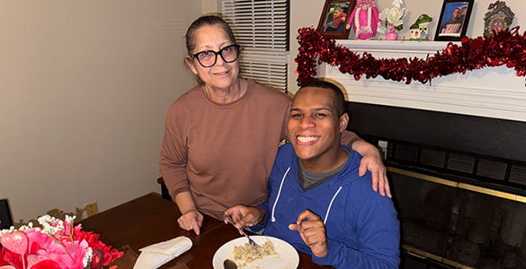 va-icare-4 Man enjoying home-cooked meal.