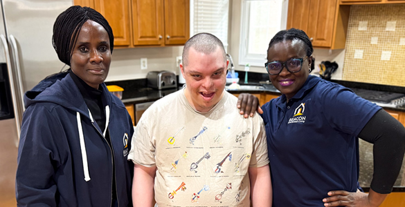 va-icare-5 Man posing with two caretakers.
